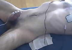 Male tied, edged less vibrator coupled with nipple estim
