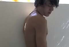 Cute twink Tristan Tyler masturbates solo while showering